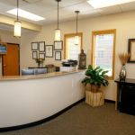 Receptionist desk area at {PRACTICE_NAME}