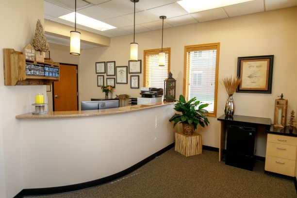 Receptionist desk area at {PRACTICE_NAME}