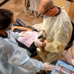 Dr. Lawson and Assistant working on a patient