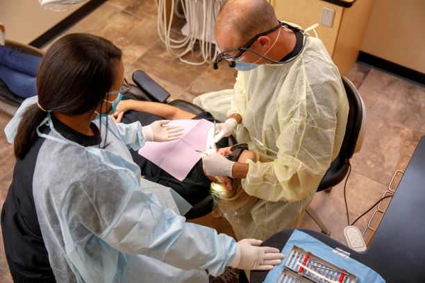 Dr. Lawson and Assistant working on a patient
