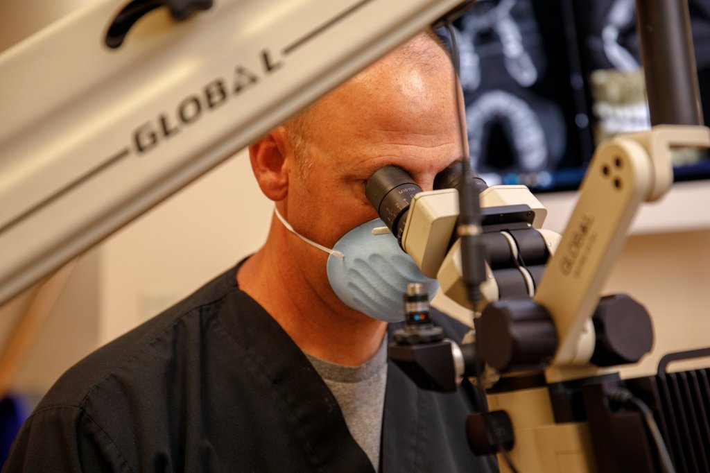 Dr. Lawson using a microscope